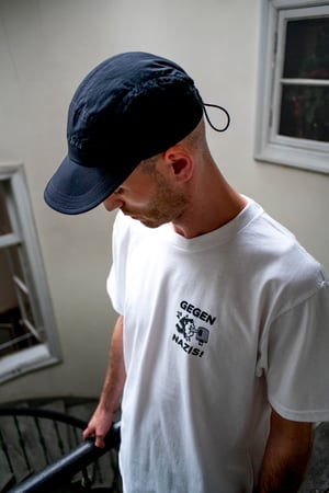 Image of UP X Random Above Reason  "WE LOVE TAGS AND HATE NAZIS" Shirt