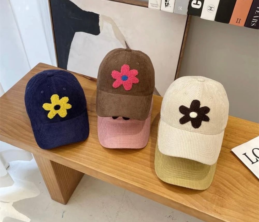 Image of Corduroy caps with plush flower 