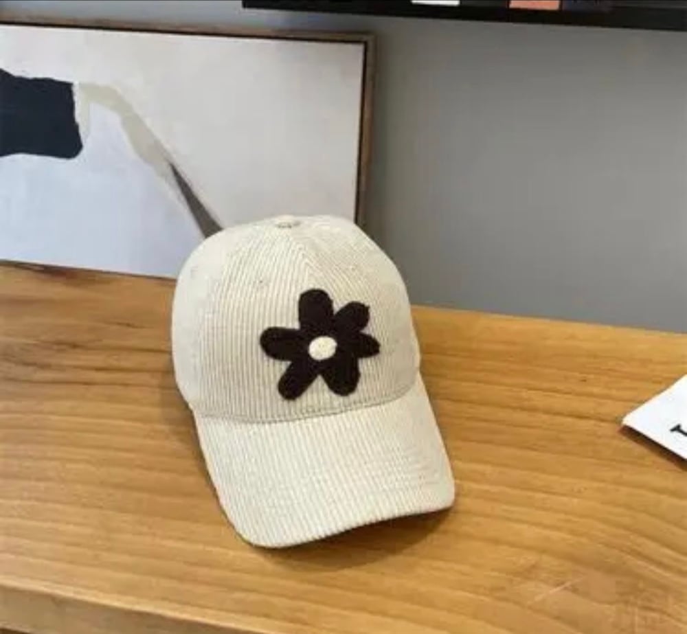 Image of Corduroy caps with plush flower 