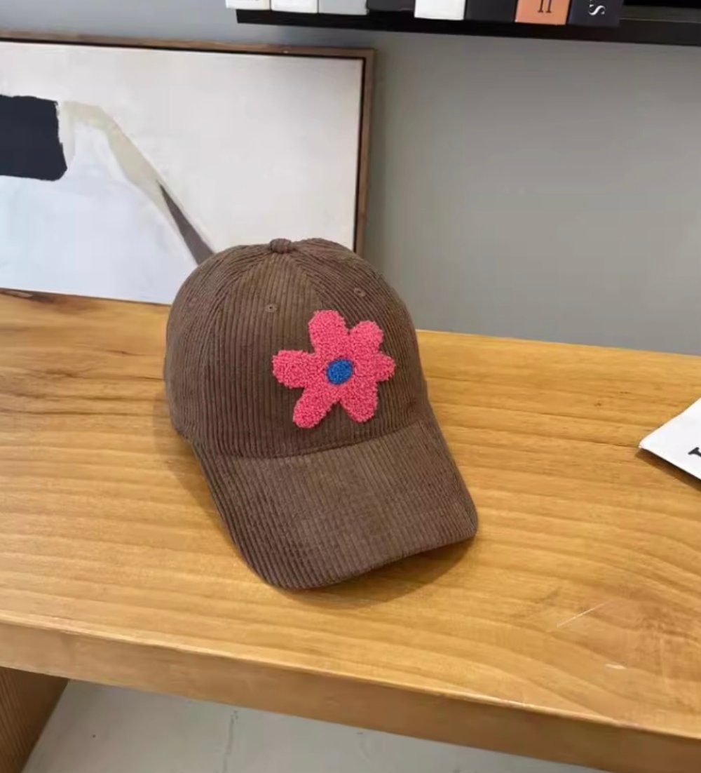 Image of Corduroy caps with plush flower 