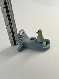 Image 7 of Green Bird sat on a thing