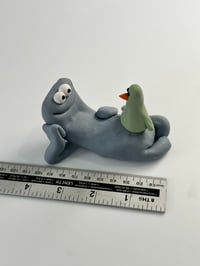 Image 6 of Green Bird sat on a thing