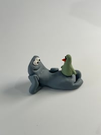 Image 3 of Green Bird sat on a thing