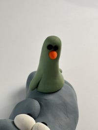 Image 4 of Green Bird sat on a thing