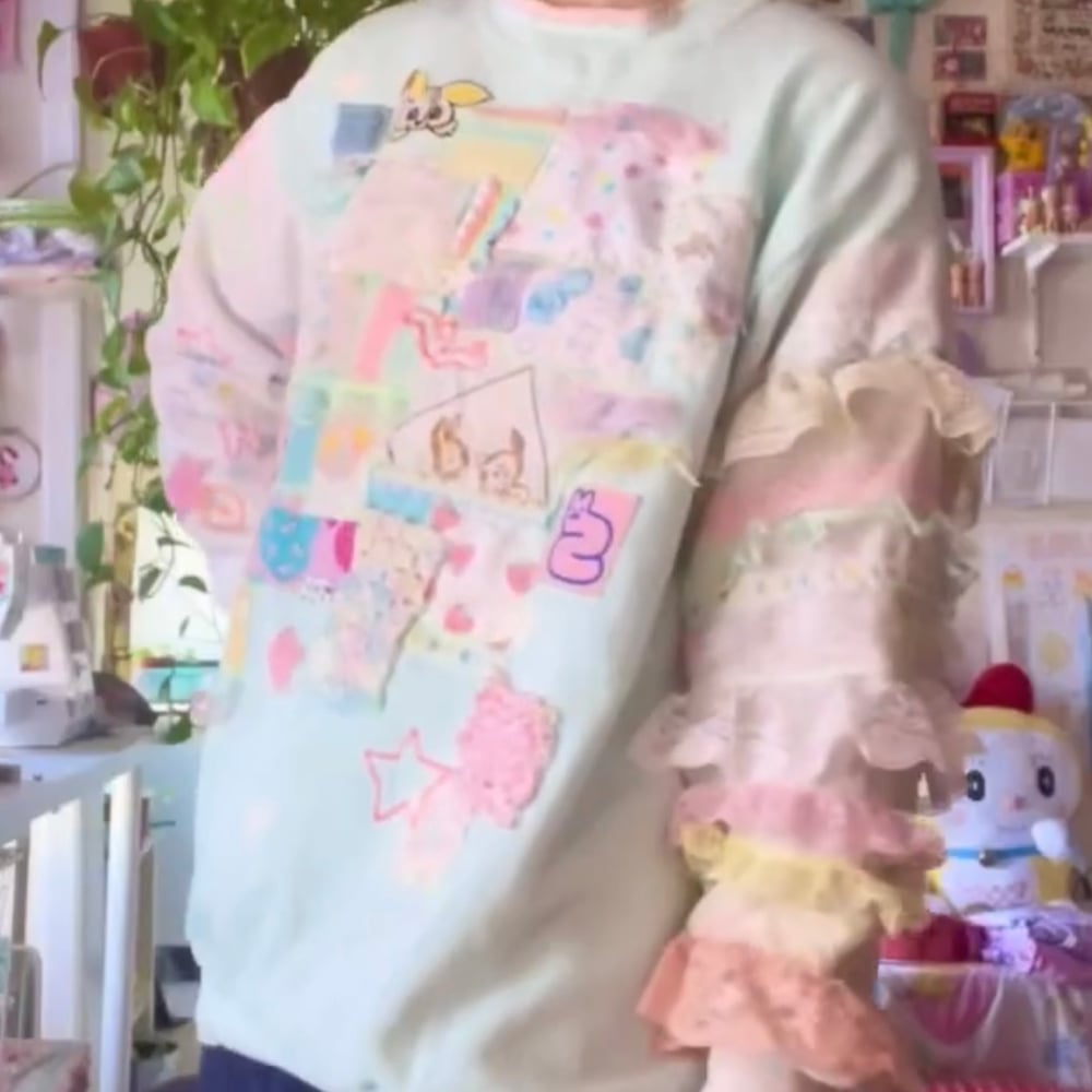 Daydream rabbit collage sweater 