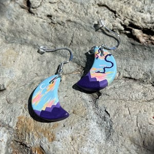 Image of Evening Flight, hand-painted ceramic bisque crescent dragon earrings