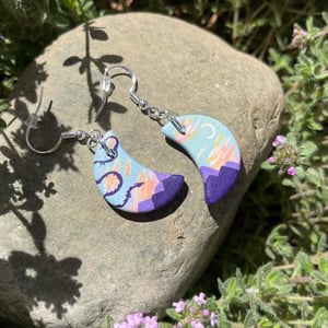 Image of Dawn Dance, hand-painted ceramic bisque crescent dragon earrings