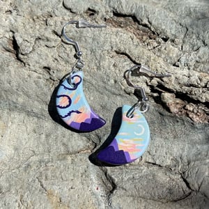 Image of Dawn Dance, hand-painted ceramic bisque crescent dragon earrings