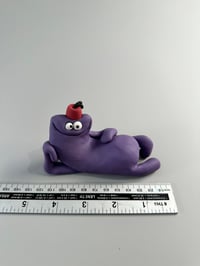 Image 7 of Purple thing with a fez