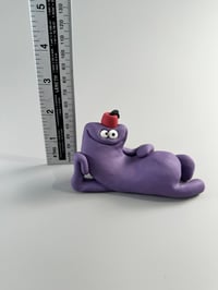 Image 5 of Purple thing with a fez