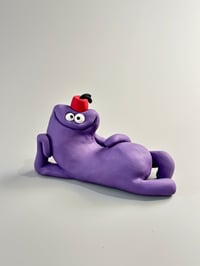 Image 1 of Purple thing with a fez