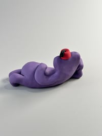 Image 3 of Purple thing with a fez