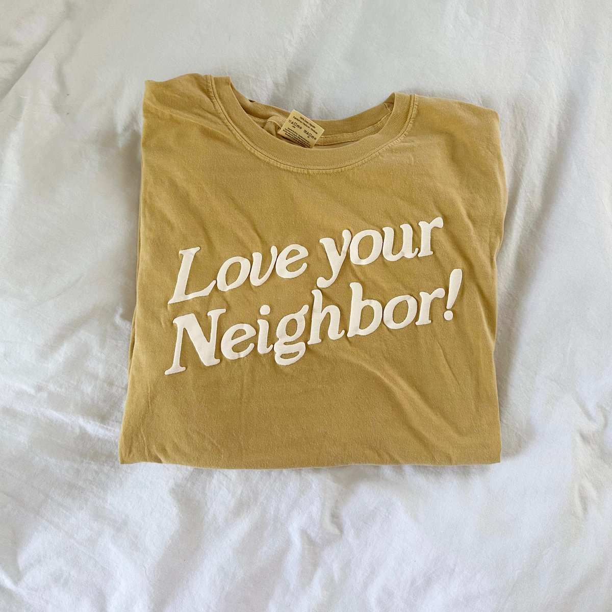 Image of mustard tee