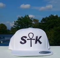 S☥K Black on White Snapback Hat