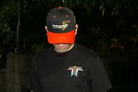 Image 1 of Orange tothetop flower hat
