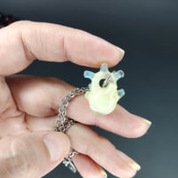 Image 1 of Creamy cloud miniature anatomical heart pendant .