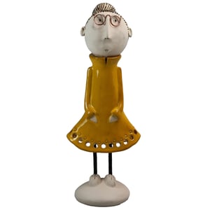 Image of Quirky Mature Couple in Green & Yellow | Lady with hair in a Bun