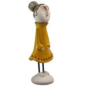 Image of Quirky Mature Couple in Green & Yellow | Lady with hair in a Bun