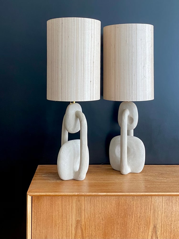 Image of handshaped light colored concrete tablelamps (2x)