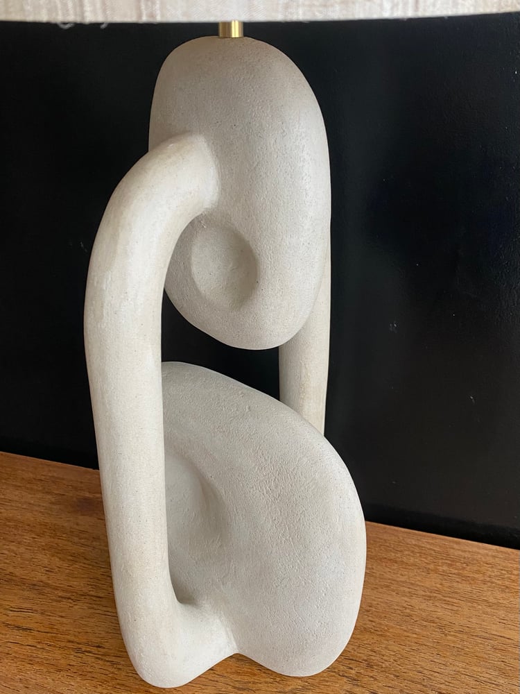 Image of handshaped light colored concrete tablelamps (2x)