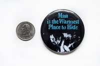 Image 2 of The Thing "Man is The Warmest Place To Hide" 2.25" Button