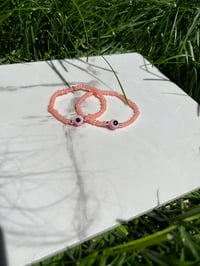 Coral Seed Evil Eye