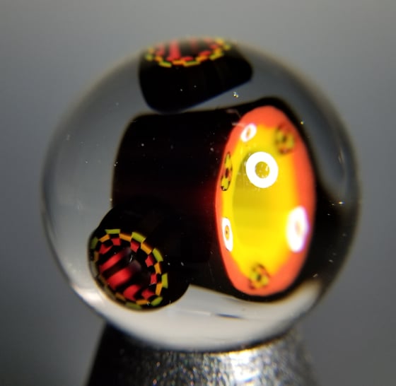 Image of 39mm Rasta Eye Vortex with Rasta Checkerboard satellites 