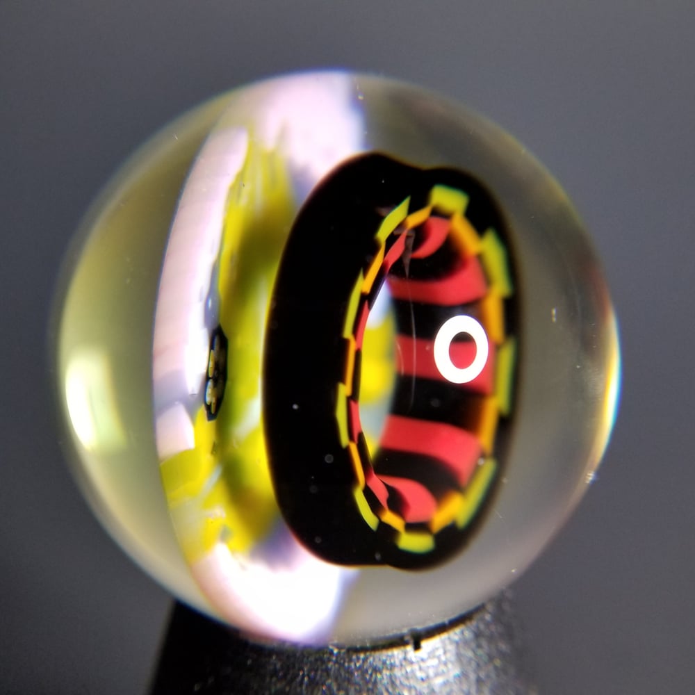 Image of 39mm UV marble with Rasta Checkerboard and Peyote Hills milli