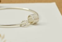 Image 5 of Silver bangle with charm and ring
