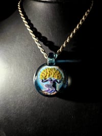 Image 1 of Bonsai tree pendant backed with blue stardust. 