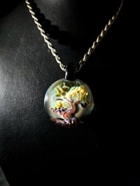 Bonsai tree pendant backed with galaxy..