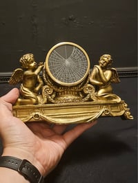 Image 1 of Golden Cherub real spider web frame ornament 