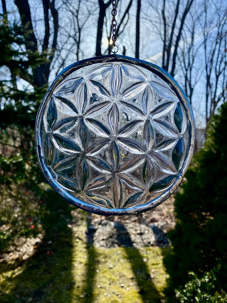 Image of Slumped Flower of Life glass circle