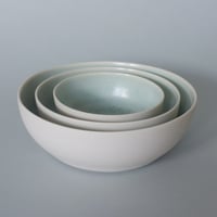 Image 1 of Small nest of 3 shallow dishes with sage green interior