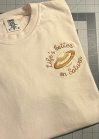 Image 2 of “Life’s Better On Saturn” Embroidered T-Shirt