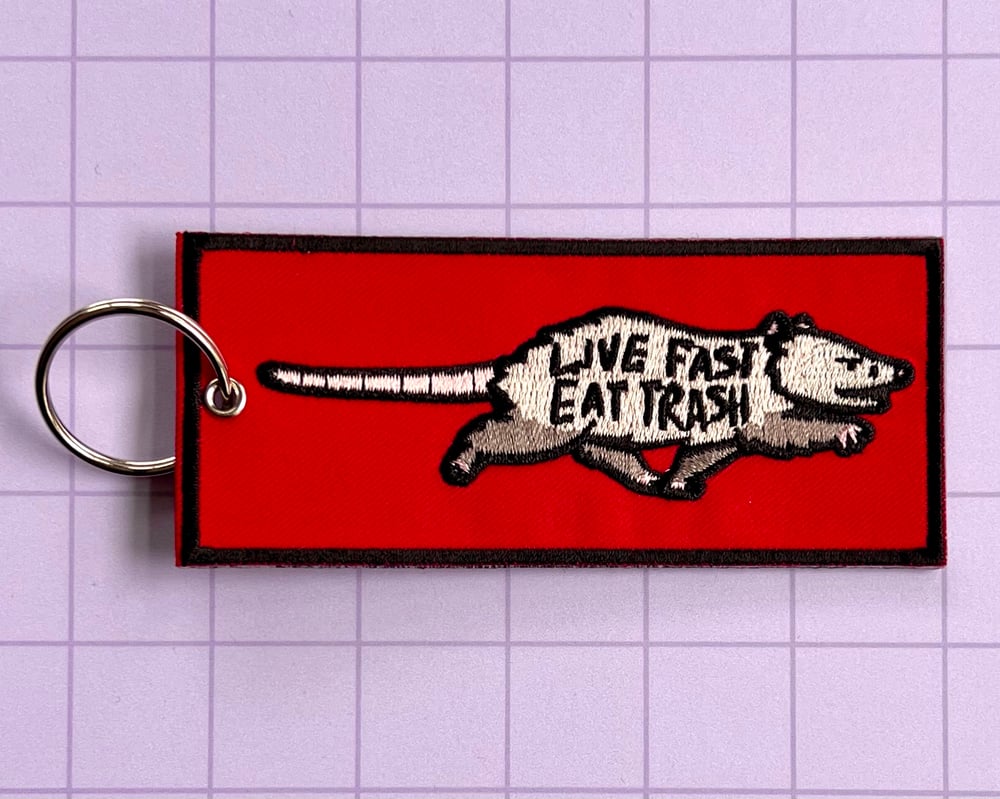 Image of Live fast eat trash possum embroidered keychain
