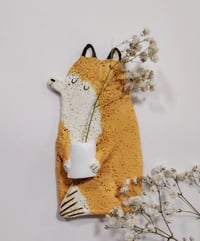 Image 1 of Sitting fox and vase