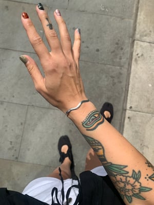 Image of ‘Wiggle’ hammered recycled silver bangle