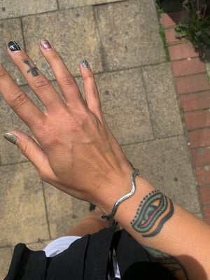 Image of ‘Wiggle’ hammered recycled silver bangle 