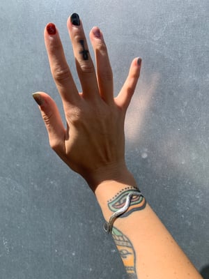 Image of ‘Wiggle’ hammered recycled silver bangle