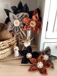 Image 1 of Memory Flowers custom created from a clients loved ones vest and dress trousers