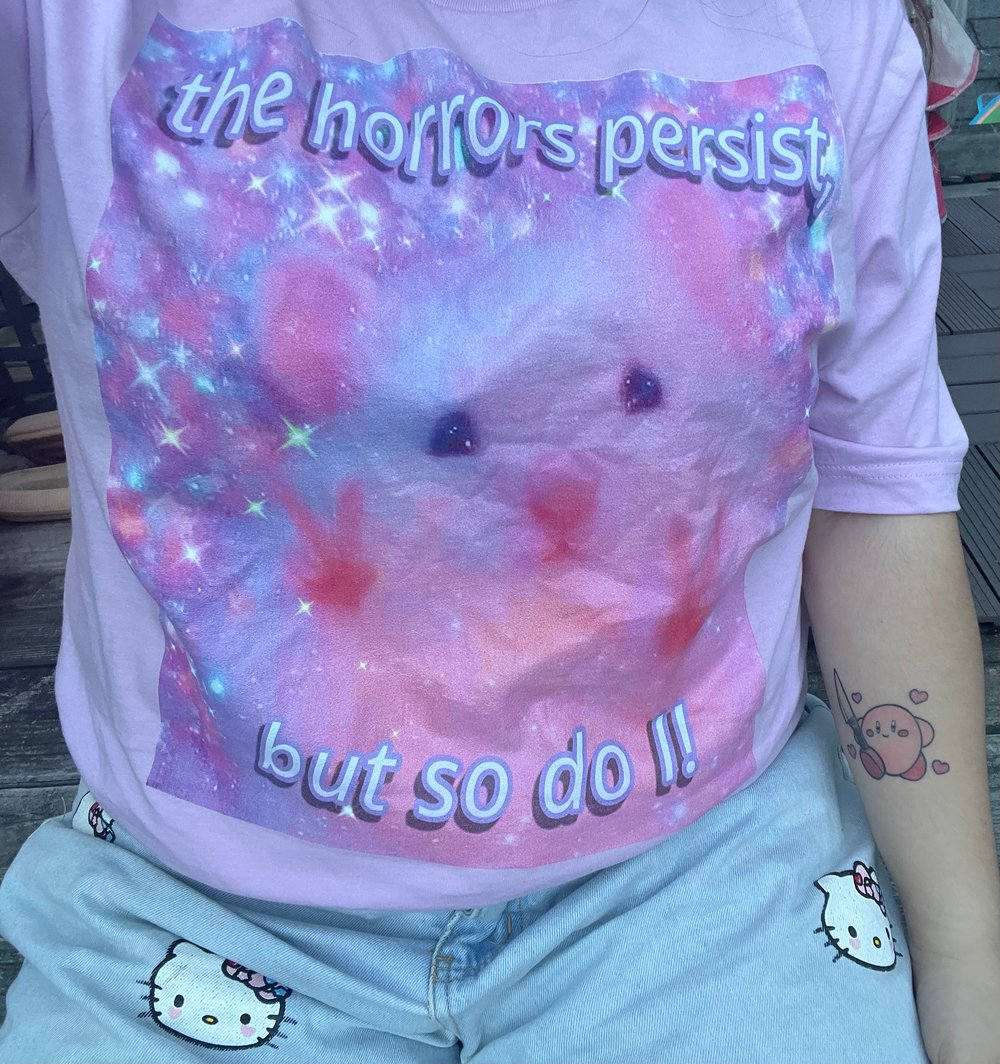 Image of “The horrors persist, but so do I” meme t-shirt 