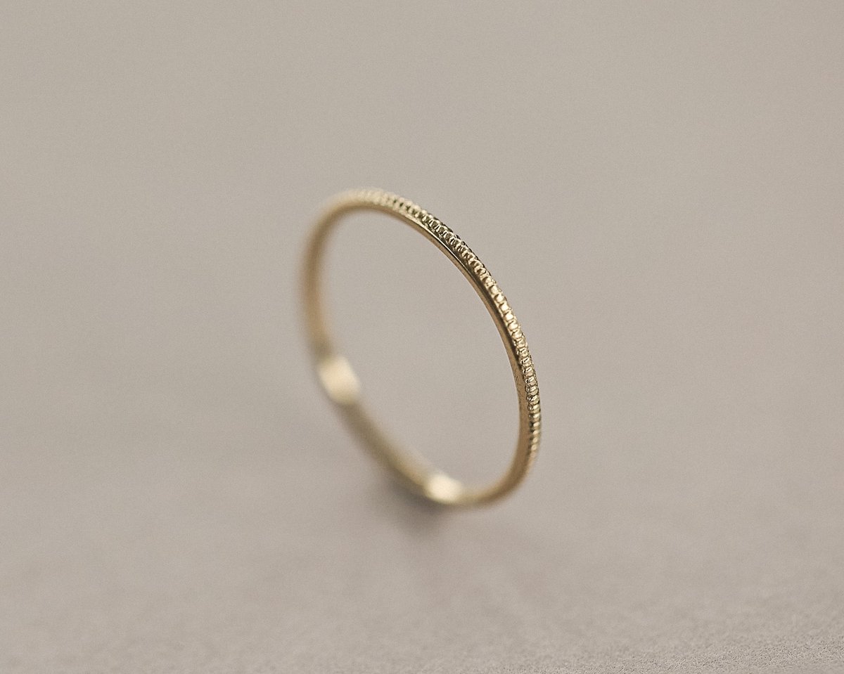 Image of 9ct yellow gold thin milled ring