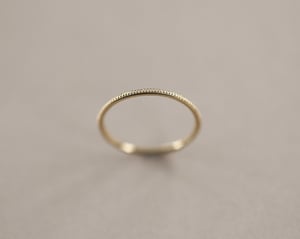 Image of 9ct yellow gold thin milled ring