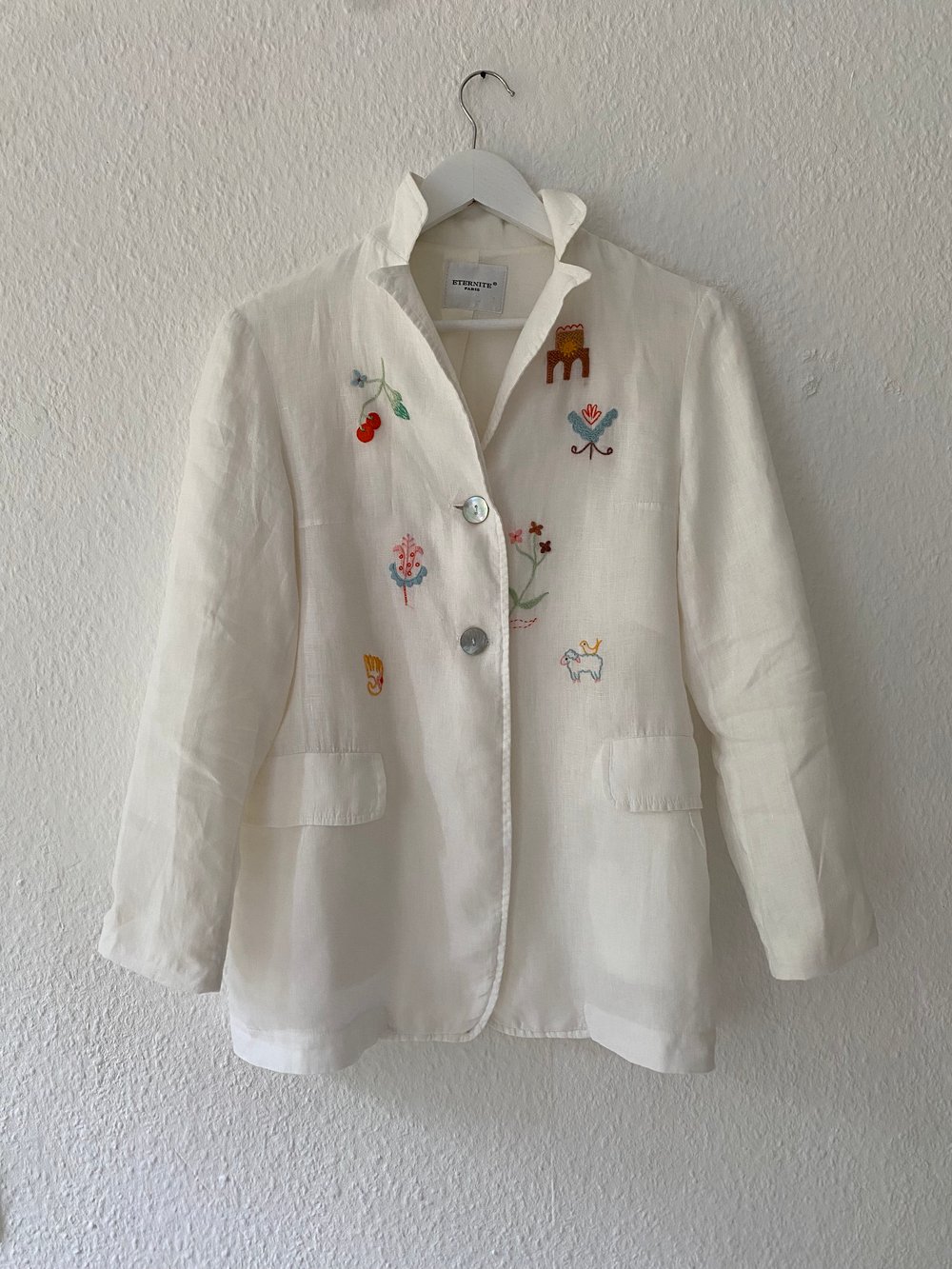 Image of Upcycled white linen blazer with hand embroidered slavic ornaments inspired motives