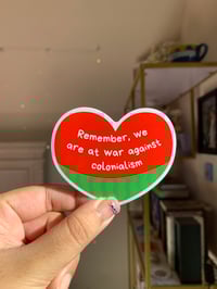 "We Are At War Against Colonialism" Sticker