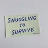 SNUGGLING TO SURVIVE Sticker