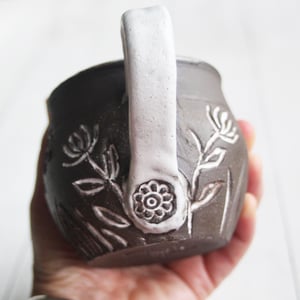 Image of Small Pottery Mug with Dark Brown Raw Stone Clay, Carved Flowers, Made in USA