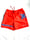 Image of beach day shorts in bright orange 