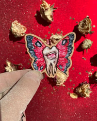 Image 1 of wooden pin. Tooth-moth